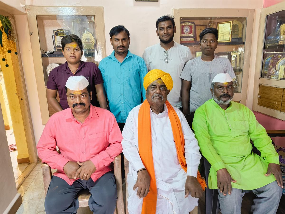 Venkappa Ambaji Sugatekar with his family memebers at his home in Bagalkot.