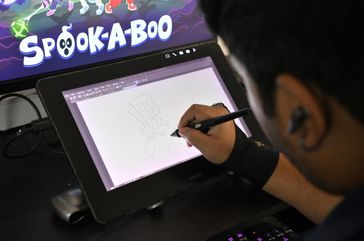 A game artist sketching character concepts at Wala Interactive game studio in Bengaluru. 