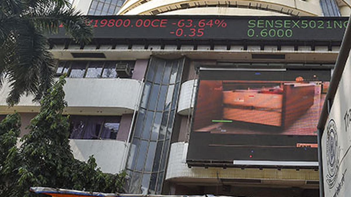 Sensex, Nifty close marginally down in range-bound trade
