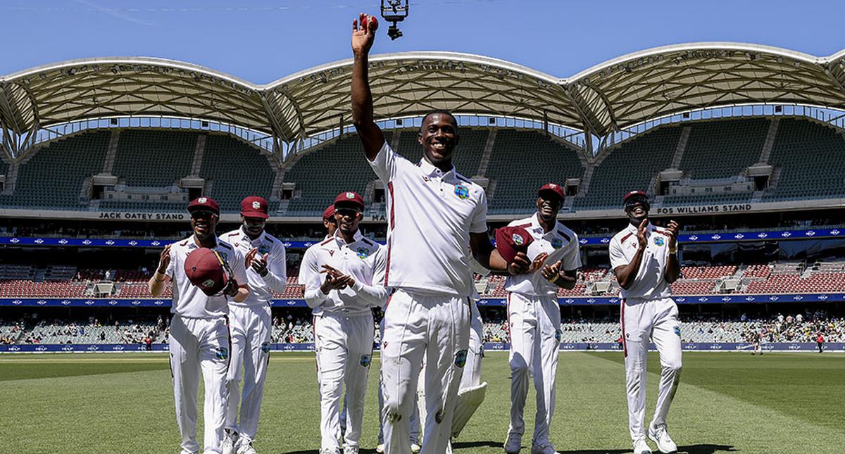 Shamar Joseph of the West Indies  holds the ball up after his five wickets as he leaves the ground during day two of the First Test in the Test match series between Australia and West Indies at Adelaide Oval on January 18, 2024 in Adelaide, Australia.
