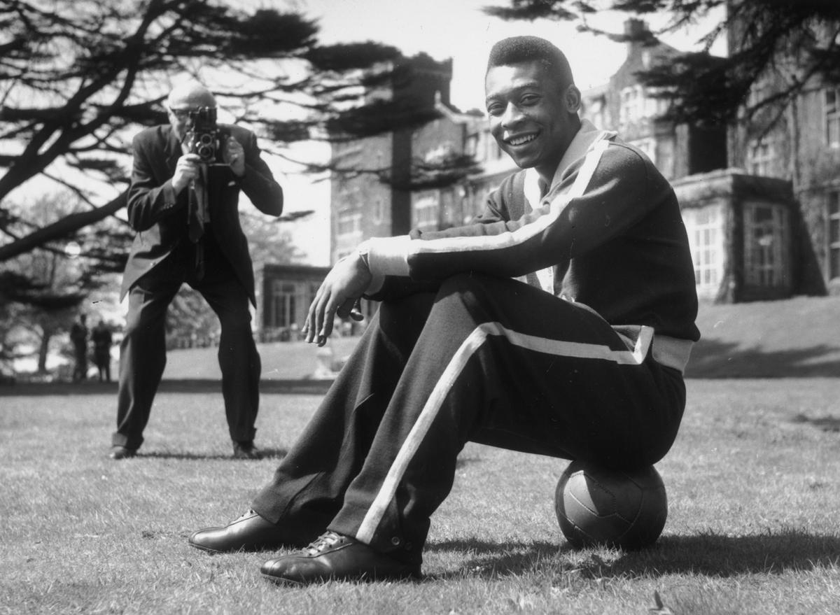 Pele takes a break from training, in England, 1963. 