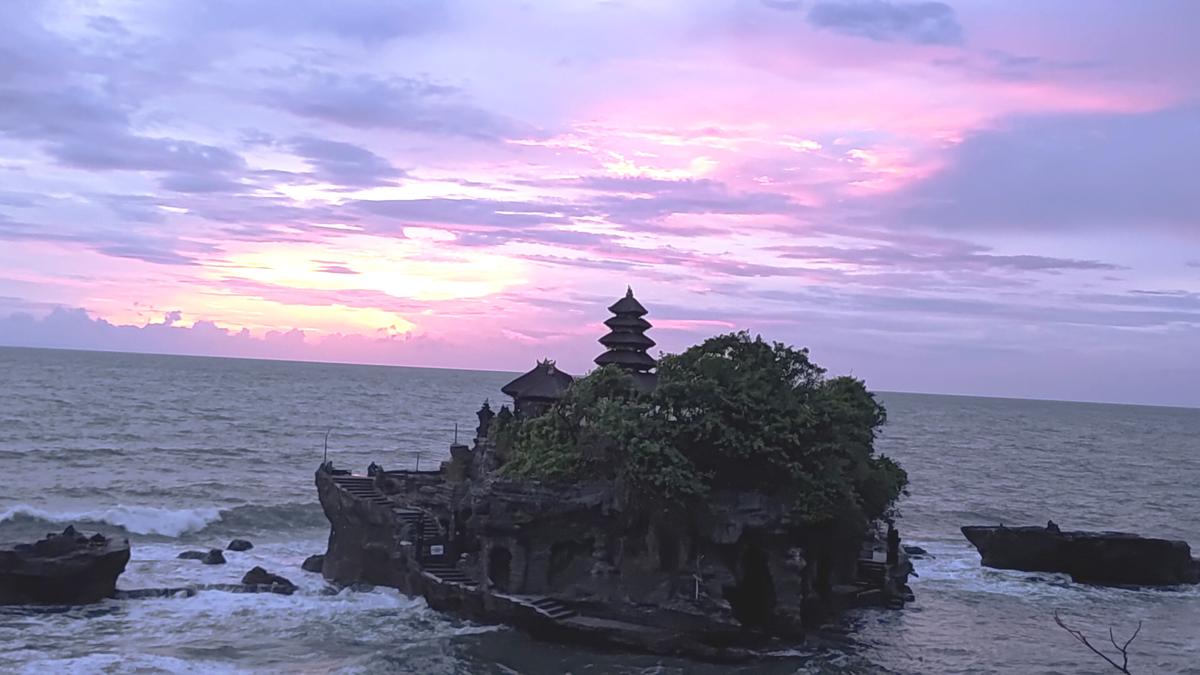 Tanah Lot temple perched on a rock formation.