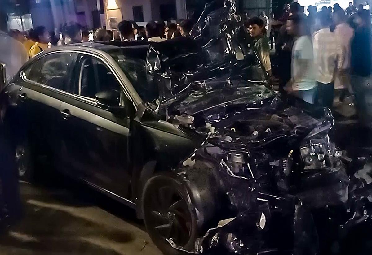 A view of the damaged car after it collided with a two-wheeler, in Vadodara on Thursday