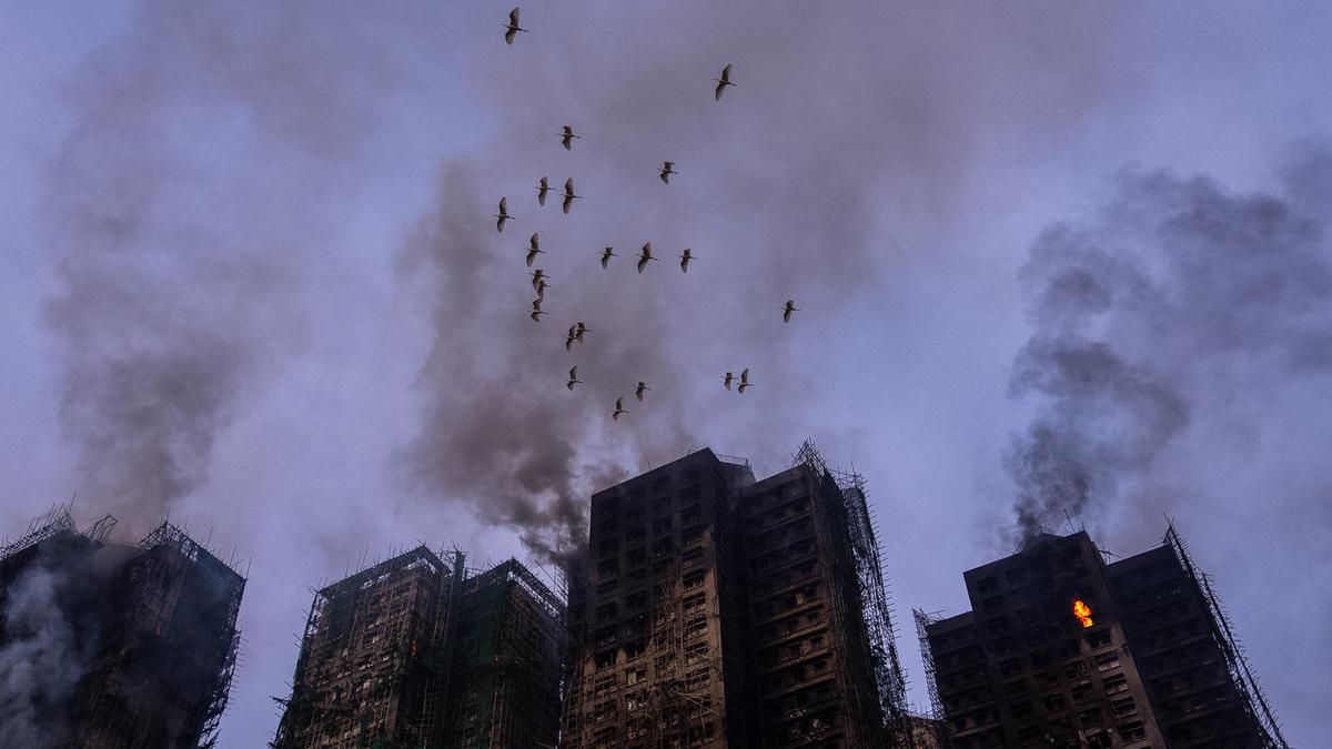 At least 65 dead as Hong Kong firefighters battle burning towers for second day