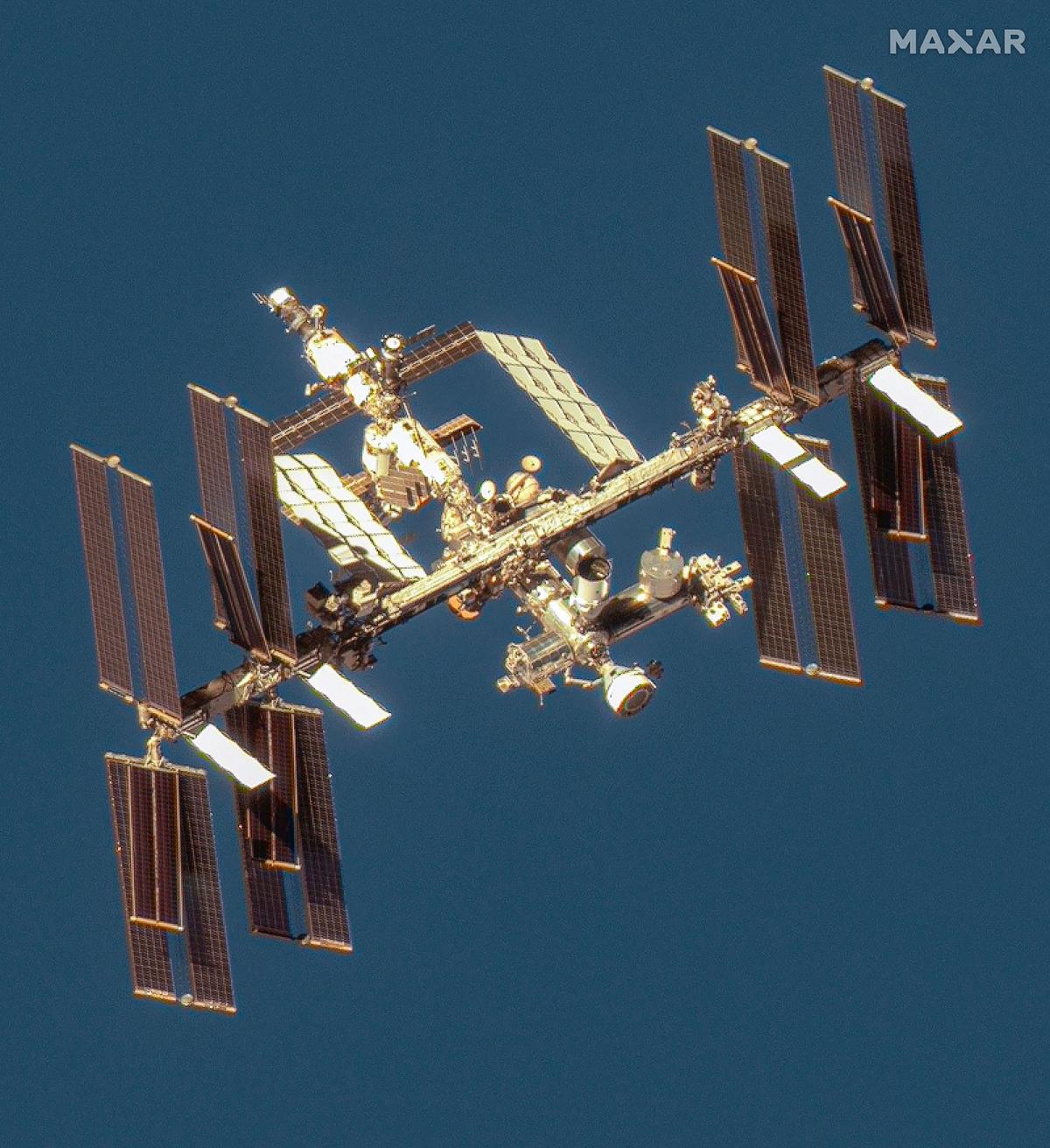 This handout image courtesy of Maxar Technologies taken on June 7, 2024 shows the Boeing Starliner spacecraft docked with the International Space Station’s (ISS) forward port on the station’s Harmony module.