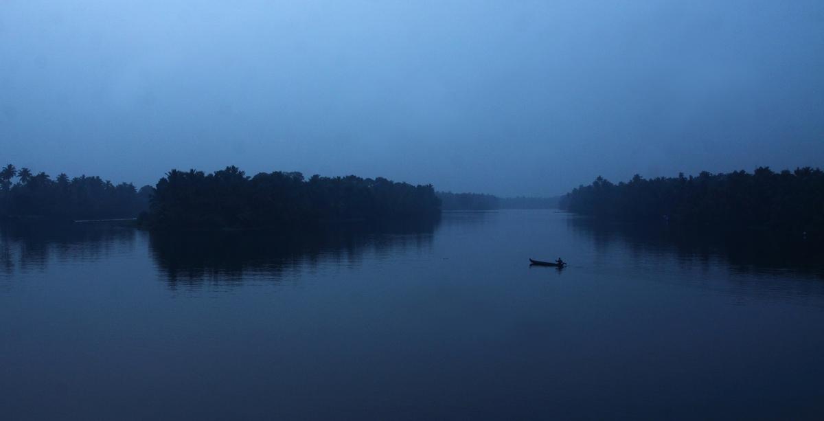 Backwater Island dwellers use country boats to travel across islands and to the mainland in this scene at daybreak from Poothotta, near Ernakulam. Without any public mode of transport or bridges linking islands, they use privately-owned country boats to cross the backwaters. 