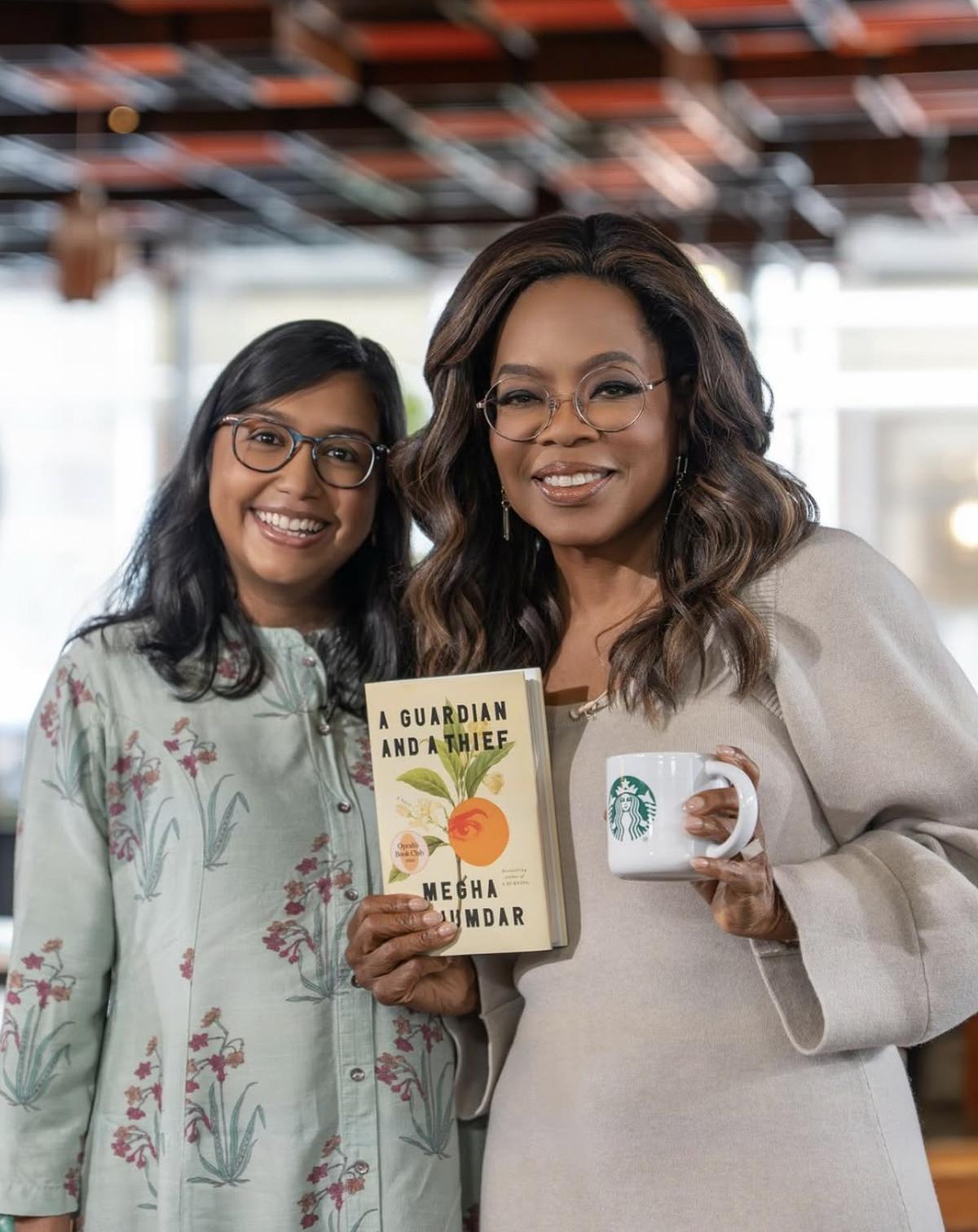 Author Megha Majumdar (left) with American talk show host Oprah Winfrey. 