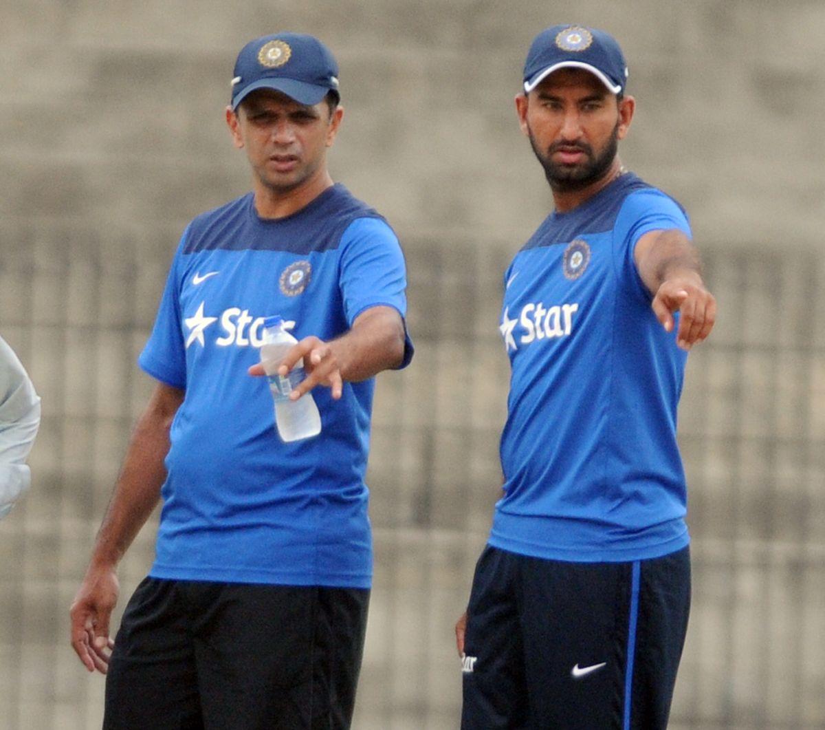 Like for like: File picture of Pujara with Rahul Dravid in Chennai