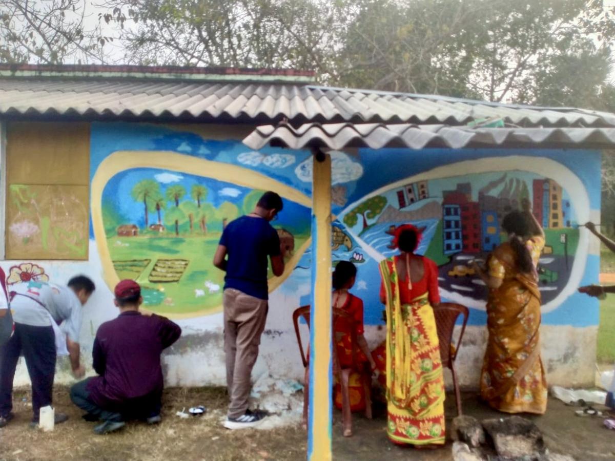 City students creating a village, and village children creating a city on the wall.  City students creating a village, and village children creating a city on the wall.
