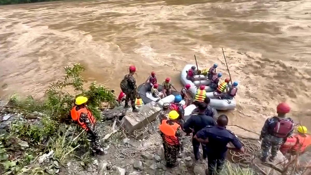 19 bodies recovered after landslide swept two buses into river in Nepal