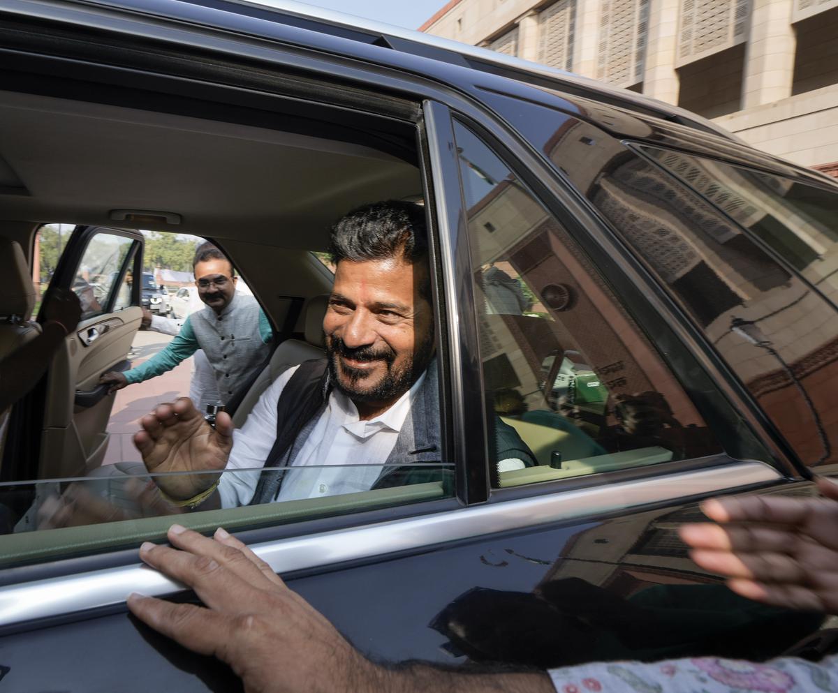 Telangana Chief Minister-designate A Revanth Reddy leaves from Parliament House complex, in New Delhi, on Wednesday.