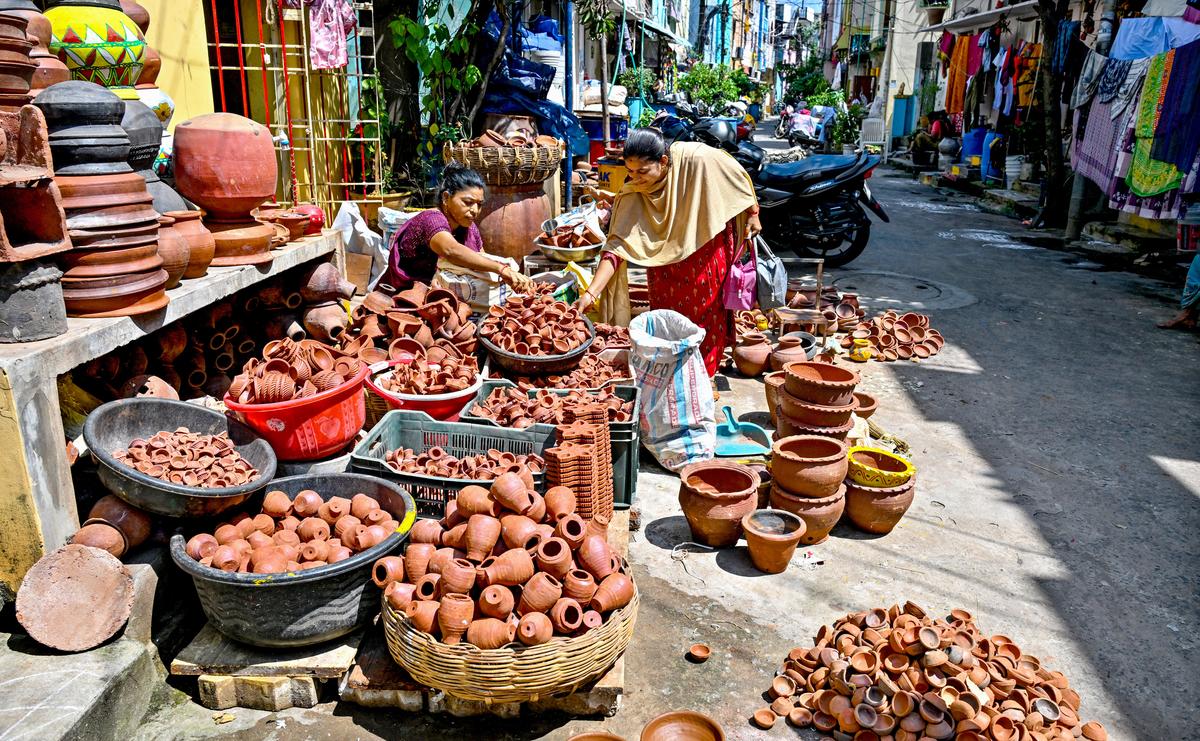 Woman selling deepams in front of her house, ahead of Deepavali, at Kummari Veedhi (potters’ street) in Visakhapatnam. Woman selling deepams in front of her house, ahead of Deepavali, at Kummari Veedhi (potters’ street) in Visakhapatnam.