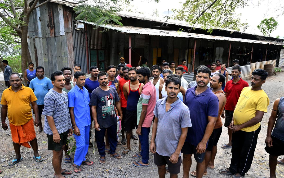 Daily-wage workers from Jharkhand anxiously wait for news about their fellow workers trapped in the Srisailam Left Bank Canal (SLBC) tunnel near Domalapenta village.