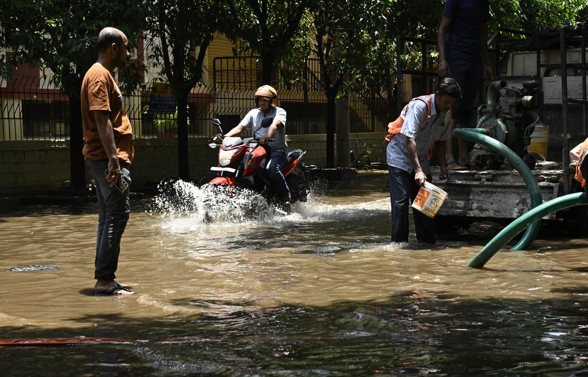 GHMC trying to clear the rainwater at Sundarayya Vignana Kendra in Hyderabad on Tuesday. 