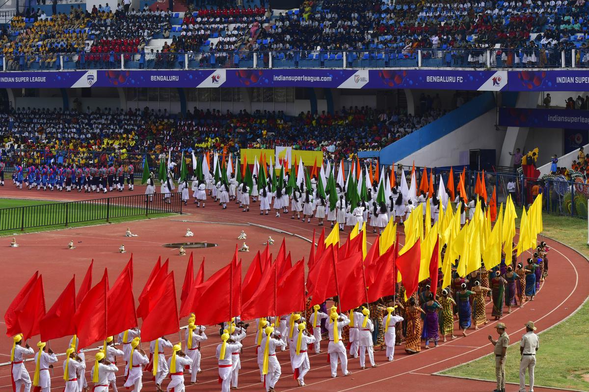 School Children march with the flags, during the Kannada Rajyotsava celebrations, at the Kanteerava Stadium in Bengaluru on November 01, 2023.