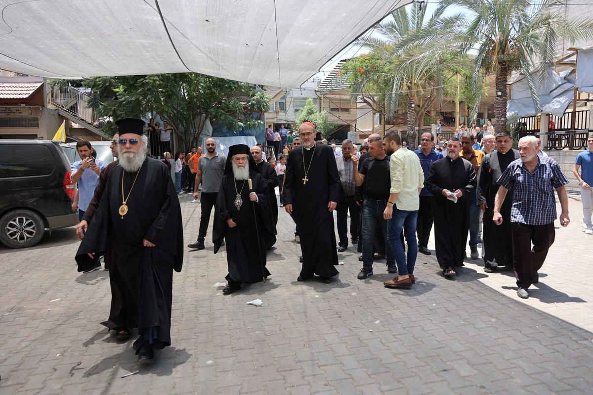 Latin Patriarch of Jerusalem Archbishop Pierbattista Pizzaballa and Greek Orthodox Patriarch of Jerusalem, Theophilos III visit the Church of the Holy Family which was hit in an Israeli strike on Thursday, in Gaza City July 18, 2025.
