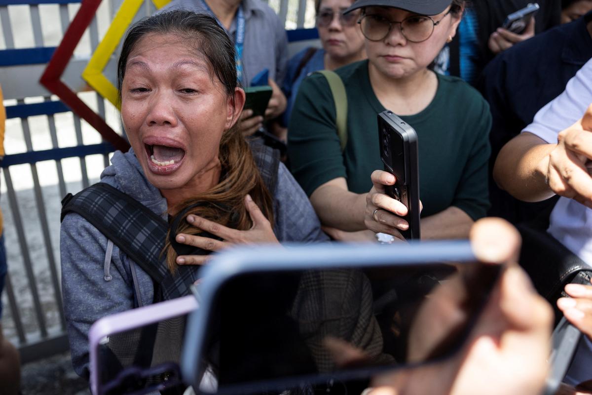 A supporter of former Philippine president Rodrigo Duterte speaks to media members outside the Villamor Airbase where Duterte is currently held after being arrested, in Pasay City, Metro Manila, Philippines, on March 11, 2025. 