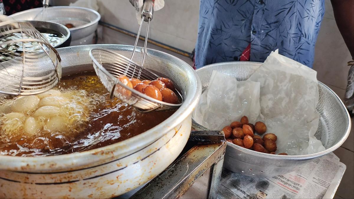 Neyyapams being fried in palm oil