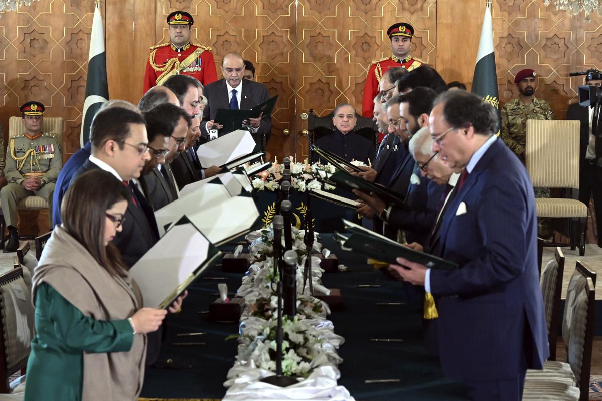 Pakistan President Asif Ali Zardari administers the oath to Federal Ministers as Prime Minister Shehbaz Sharif watches during a ceremony at the Presidential Palace, in Islamabad on March 11, 2024. Photo: Pakistan President’s Office via AP