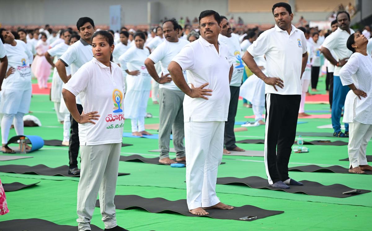 People performing yoga on the occasion of the International Yoga Day, at the Indira Gandhi Municipal Stadium, in Vijayawada, on  Saturday.