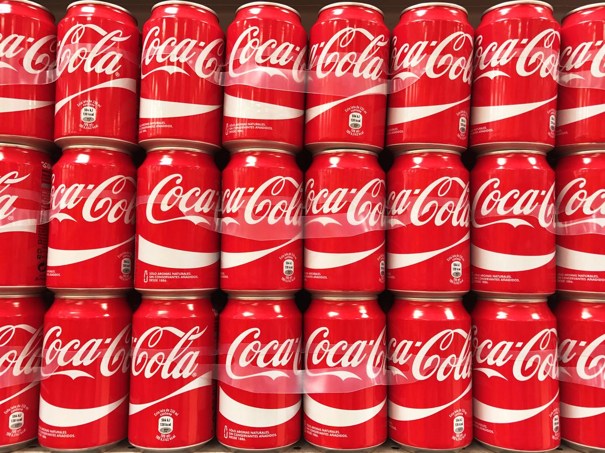 Coca-Cola cans stacked at a supermarket in Spain.