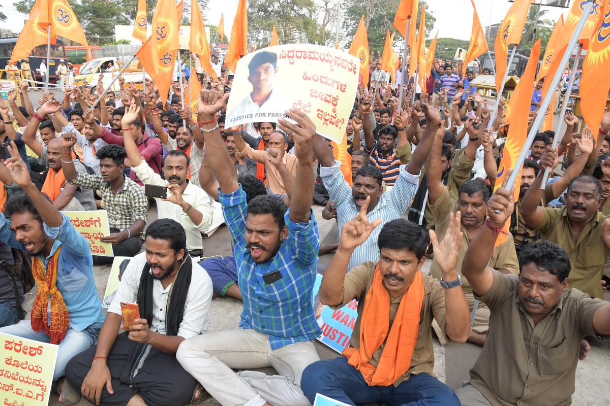 Workers of Vishwa Hindu Parishath and Bajrang Dal stage a protest against the death of Paresh Mesta, in front of the deputy commissioner's office in Mangaluru on December 13, 2017. 