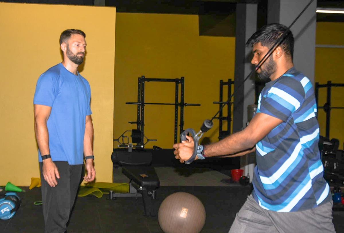 American strength and conditioning expert Caleb Linn (left) with shuttler Satwiksairaj Rankireddy. 