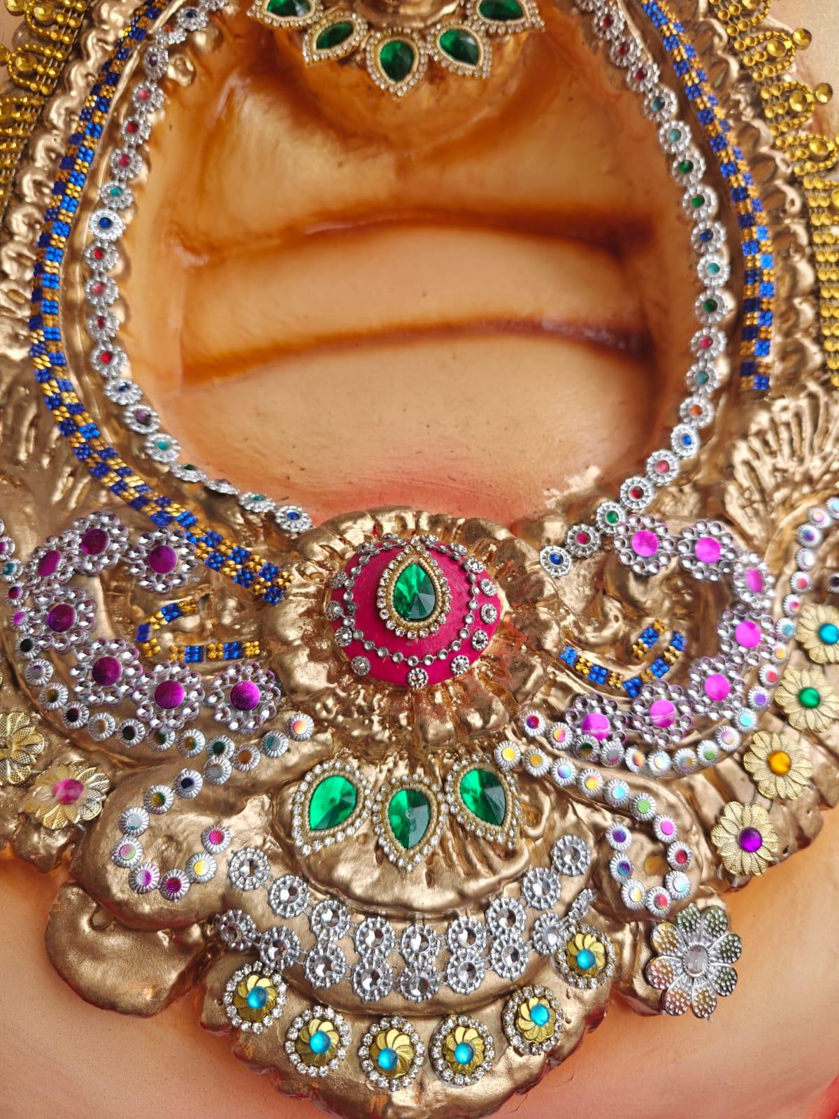 Studded with multi-coloured stones 