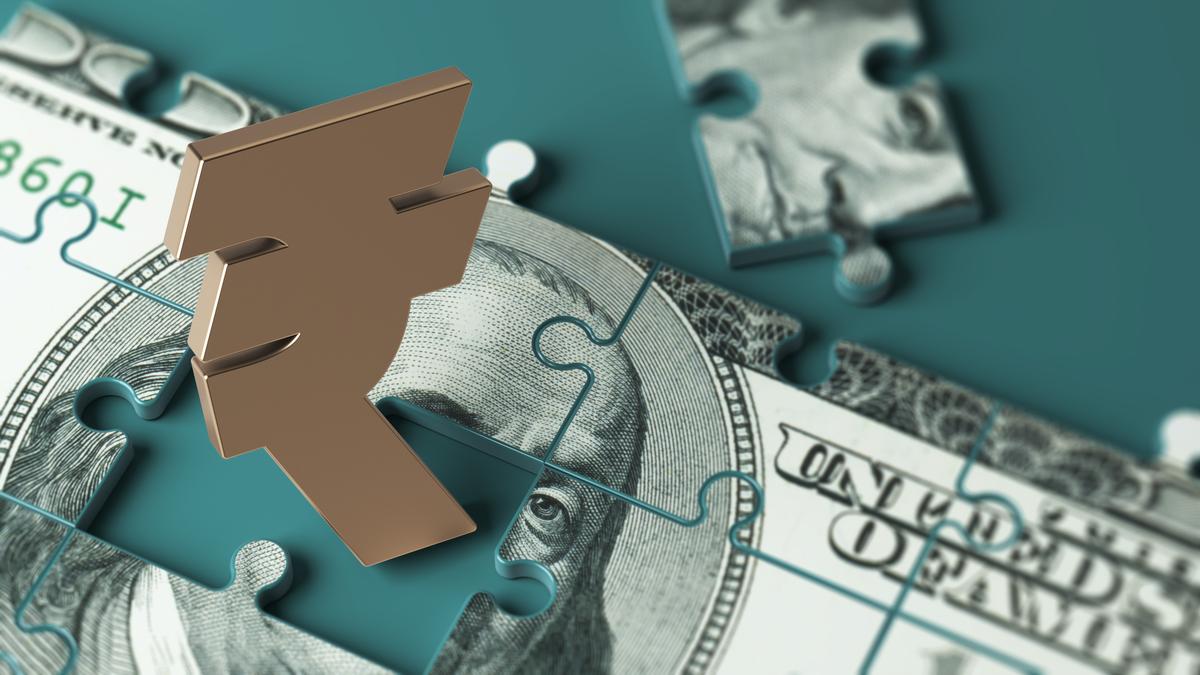 Rupee falls 14 paise to close at 90.09 against U.S. dollar