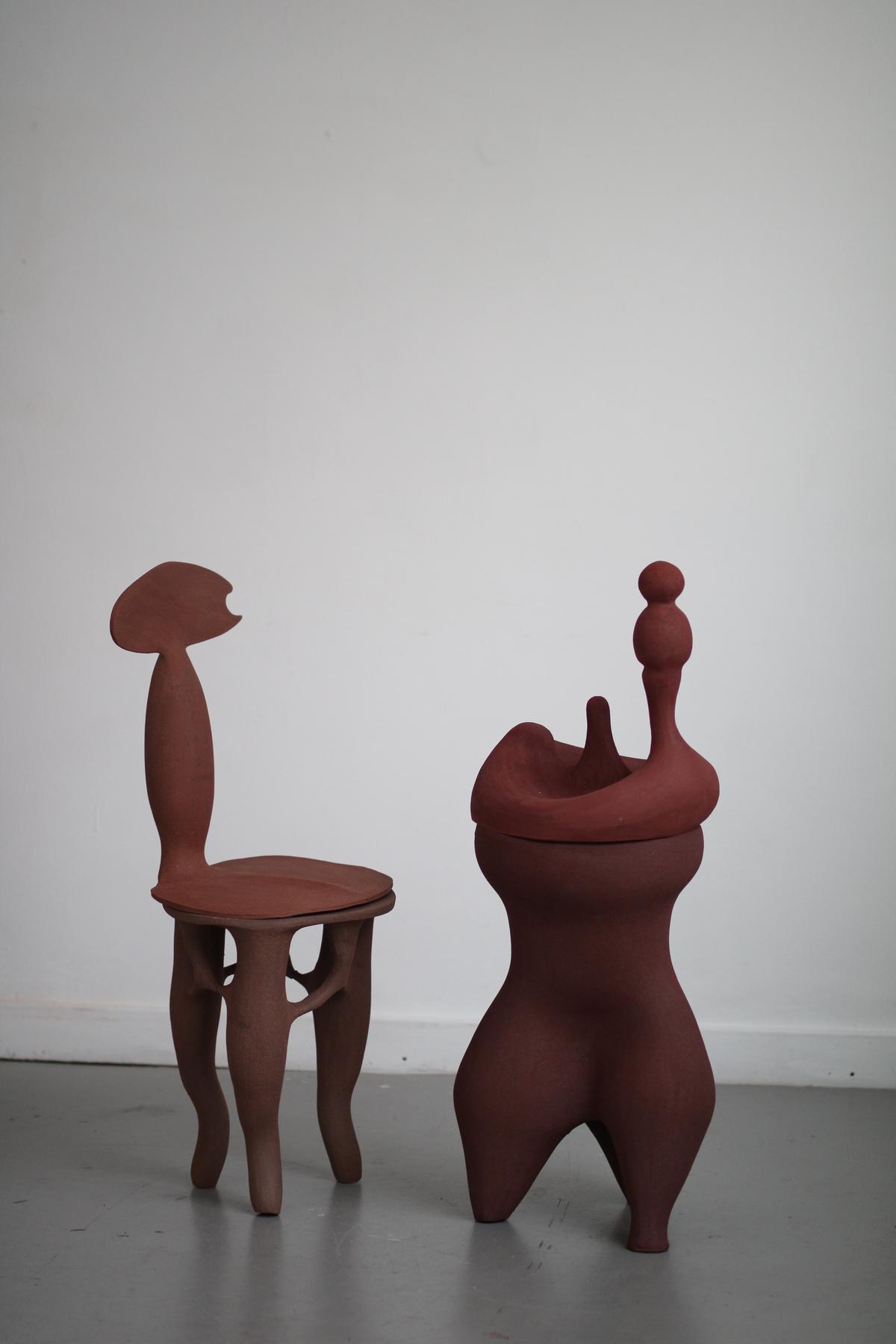 Objets Mito by Abid Javed. Three legged modular 02 chair in brown stoneware (L) and three-legged sculpture in red stoneware.