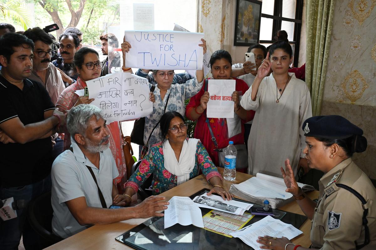 Family members and friends of Twisha Sharma protesting at the police station after an alleged denial of an FIR. Family members and friends of Twisha Sharma protesting at the police station after an alleged denial of an FIR.