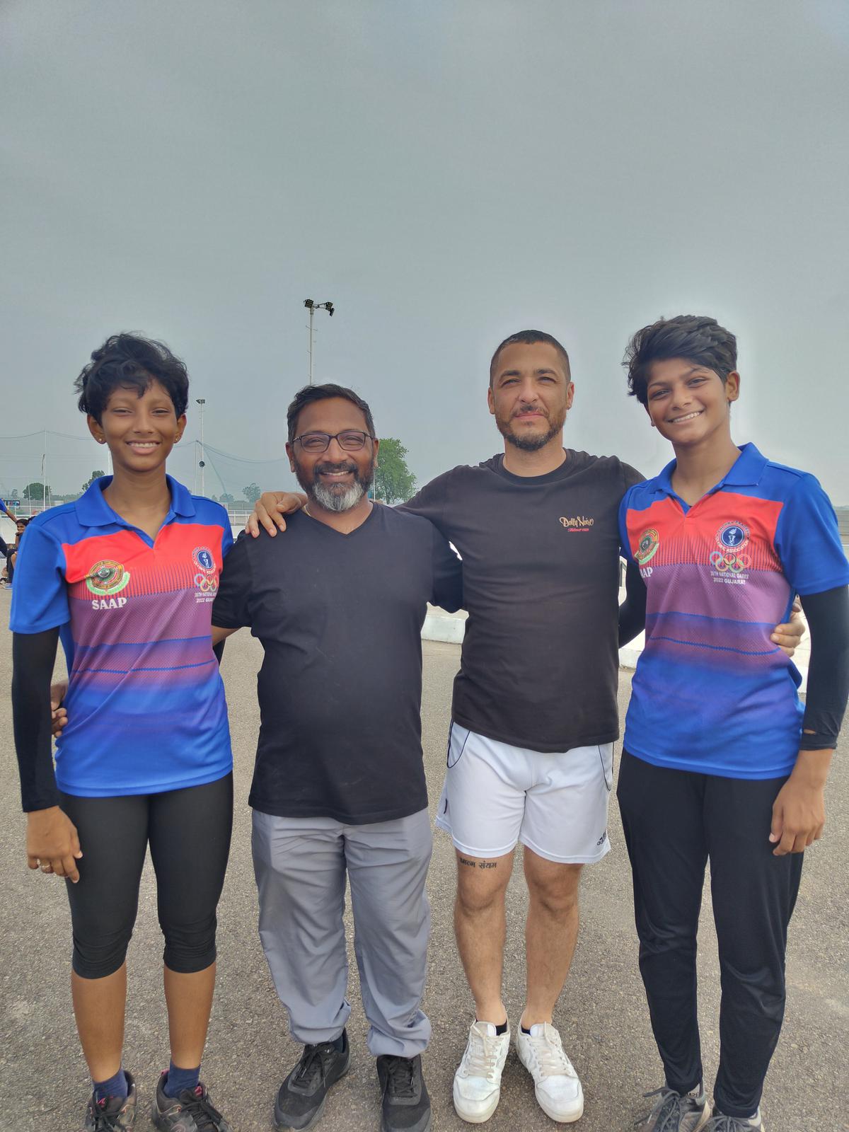 Dontara Greeshma and Akula Sai Samhitha with the coaches at the 15-day training camp at Dhelpur.