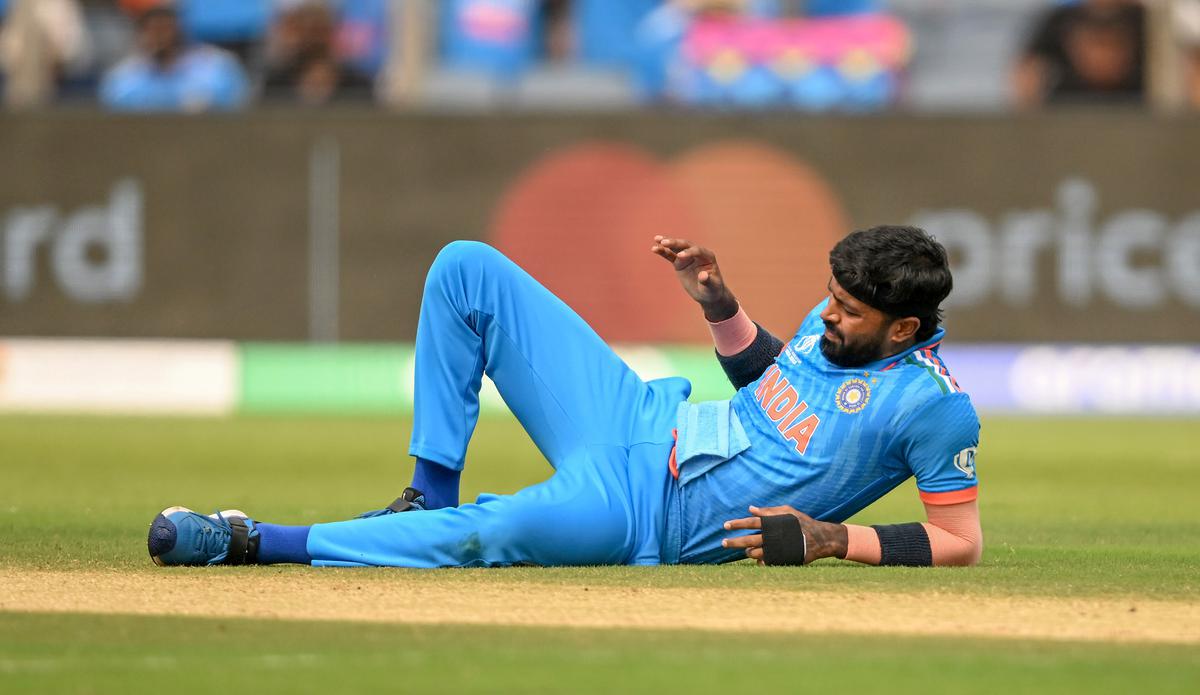 India’s Hardik Pandya falls to the ground after injuring his left ankle during the match against Bangladesh in the ICC Men’s Cricket World Cup 2023, at Maharashtra Cricket Association Stadium, in Pune on October 19, 2023.