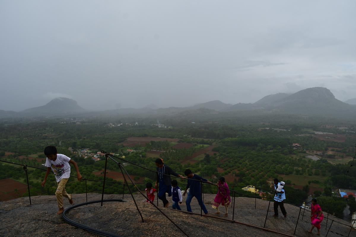Visitors atop Revanasiddeshwara Betta.