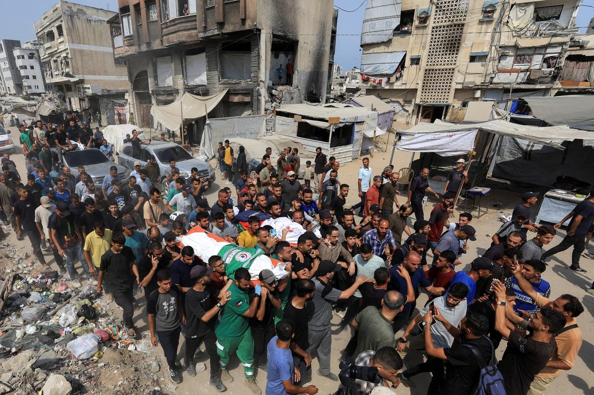Mourners attend the funeral of Al Jazeera journalists Anas Al Sharif, Mohammed Qreiqeh, Ibrahim Zaher, Mohammed Noufal and another colleague, who were killed in an Israeli strike, in Gaza City August 11, 2025.