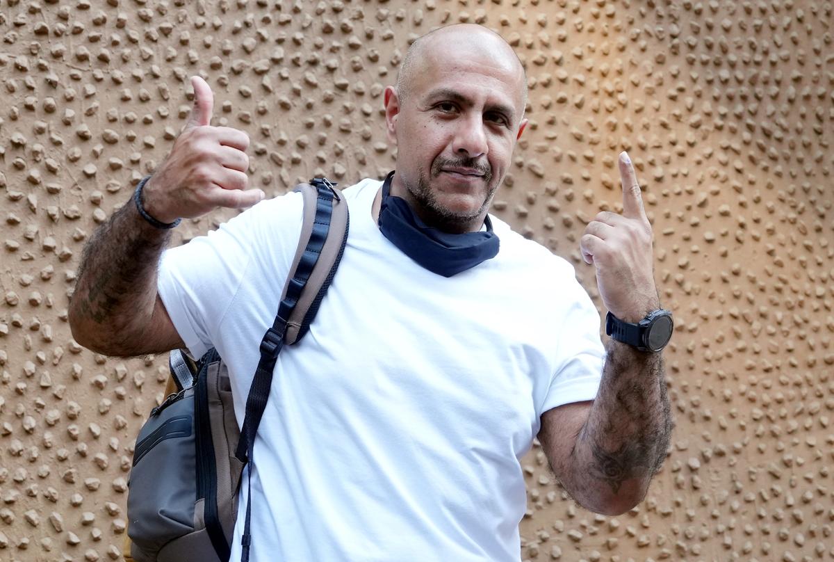 Singer and music composer Vishal Dadlani shows his finger marked with indelible ink at a polling station after casting vote during the Maharashtra Assembly elections, in Mumbai