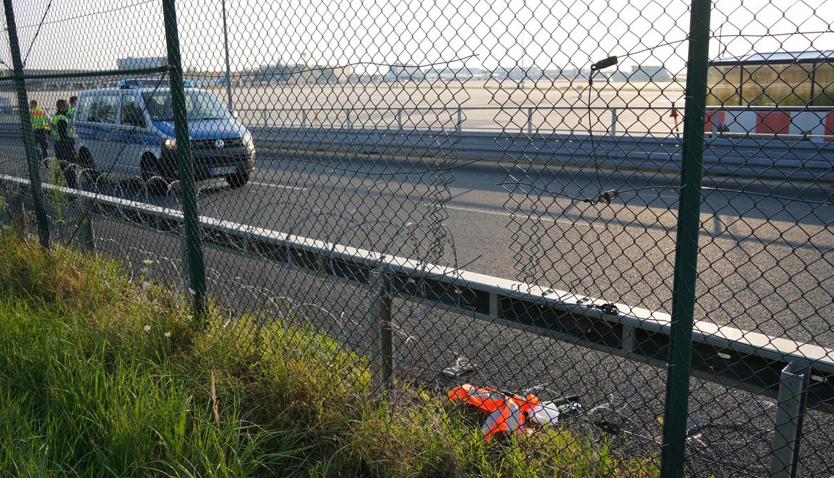 Police secures the area after activists of the “Letzte Generation” (Last Generation) cut a hole in a fence and staged a demonstration near the runways at the airport in Frankfurt, Germany July 25, 2024.