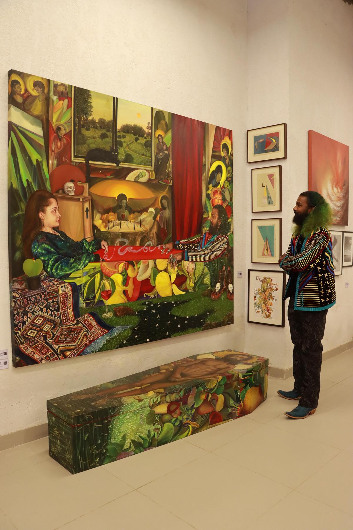 Tito Stanley with his artworks at Fresh Produce exhibition at Method Art Gallery in Delhi