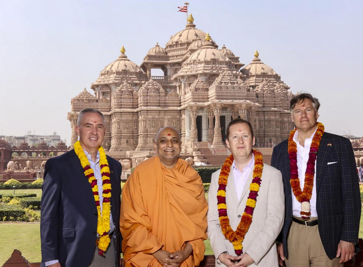 In this image posted on March 4, 2026, (from right) United States Deputy Secretary of State Christopher Landau, U.S. Ambassador to India Sergio Gor and U.S. Space Force's General Whiting (left) during a visit at the Akshardham temple, in New Delhi. Photo: X/@DelhiAkshardham via PTI