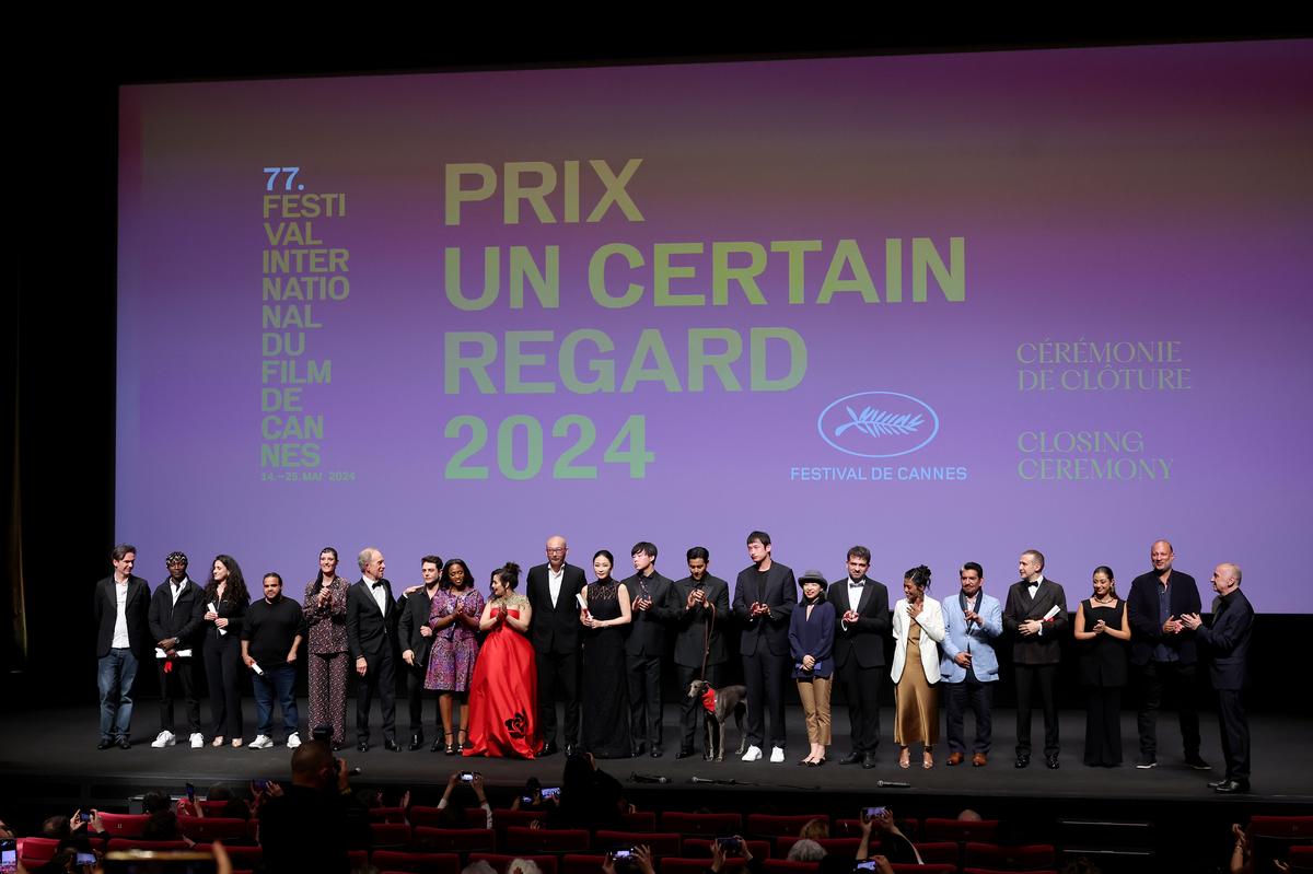 CANNES, FRANCE - MAY 24: Boris Lojkine, Abou Sangare, Louise Courvoisier, Tawfik Alzaidi, Vicky Krieps,  Todd McCarthy, Xavier Dolan, Maïmouna Doucouré, Asmae El Moudir, Guan Hu, Liang Jing, Eddie Li, Anasuya Sengupta, Abdullah Al-Sadhan, Roberto Minervini, Maria Bahrawi and Bandar Alabdulsalam pose onstage during the Un Certain Regard closing ceremony at the 77th annual Cannes Film Festival at Palais des Festivals on May 24, 2024 in Cannes, France. (Photo by Cindy Ord/Getty Images)