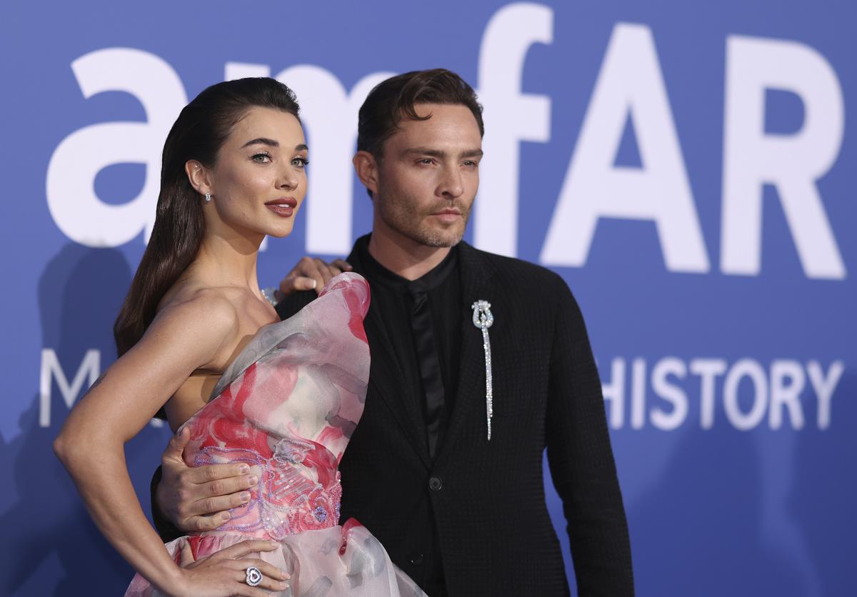 Amy Jackson, left and Ed Westwick pose for photographers upon arrival at the amfAR Cinema Against AIDS benefit at the Hotel du Cap-Eden-Roc, during the 76th Cannes international film festival
