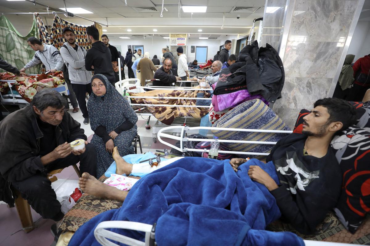 Palestinians who were wounded in Israeli fire while waiting for aid receive treatment at the Al Shifa hospital, amid the ongoing conflict between Israel and Hamas, in Gaza City, March 1, 2024.