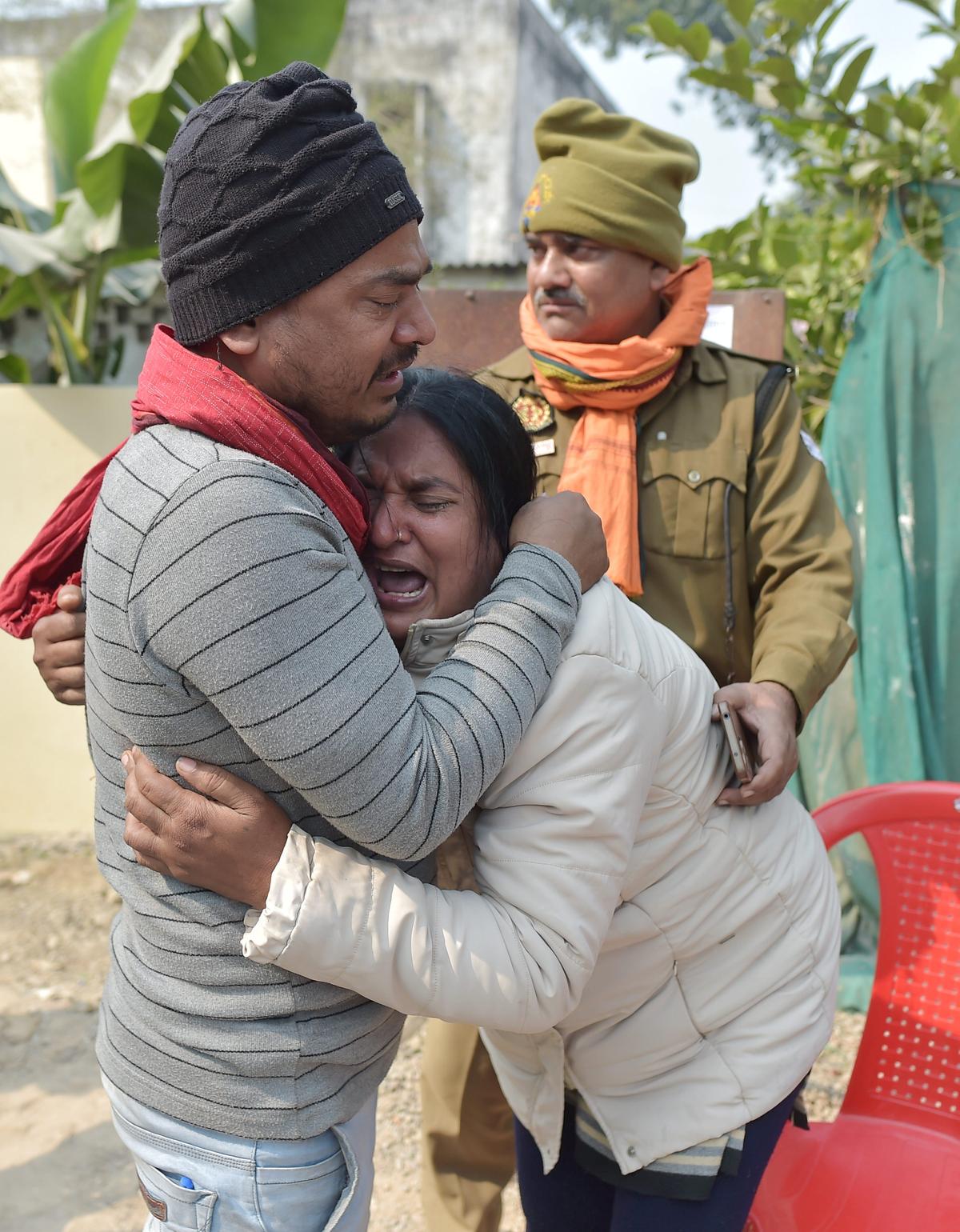 A woman cries while searching for her missing relative at the Motilal Nehru Medical College, where bodies of the stampede victims are kept. A woman cries while searching for her missing relative at the Motilal Nehru Medical College, where bodies of the stampede victims are kept.