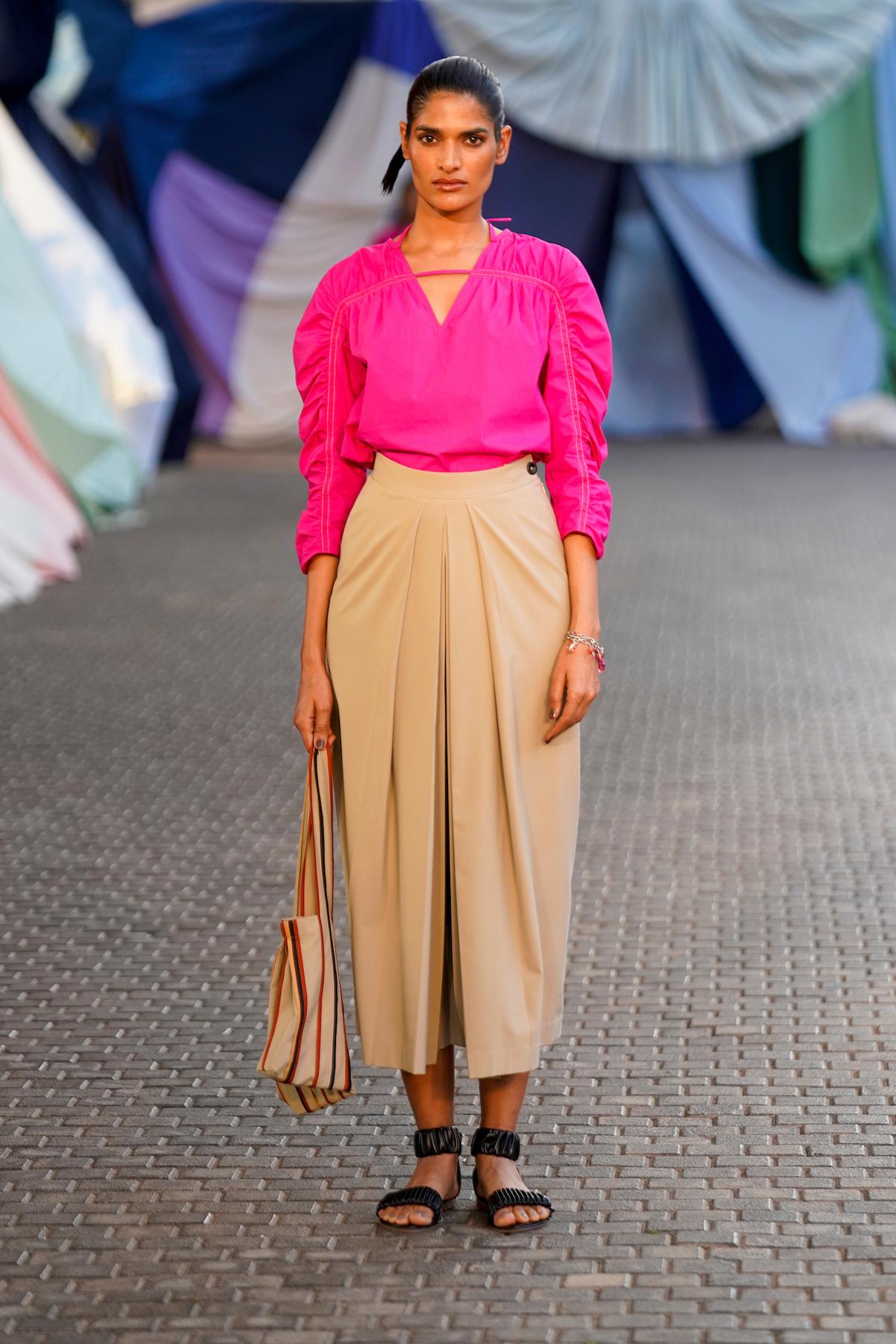 A model walks the ramp for the Bodice show by Rise Worldwide at Lakmé Fashion Week 2023 at Jio gardens in Mumbai. Assymetric tent tops had tie-up detailing at the waist, while a wide assortment of sundresses were uniquely panelled with gentle, feminine tailoring