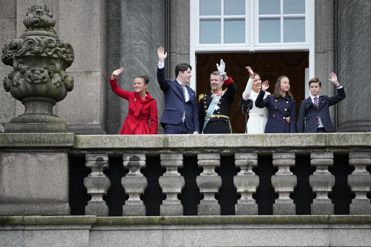 Denmark’s King Frederik X and Queen Mary, together with their children from left, Princess Josephine, Crown Prince Christian, Princess Isabella and Prince Vincent wave after the proclamation, at Christiansborg Palace, in Copenhagen, Sunday, Jan. 14, 2024. Denmark’s prime minister proclaimed Frederik X as king after his mother Queen Margrethe II formally signed her abdication. Massive crowds turned out to rejoice in the throne passing from a beloved monarch to her popular son. 