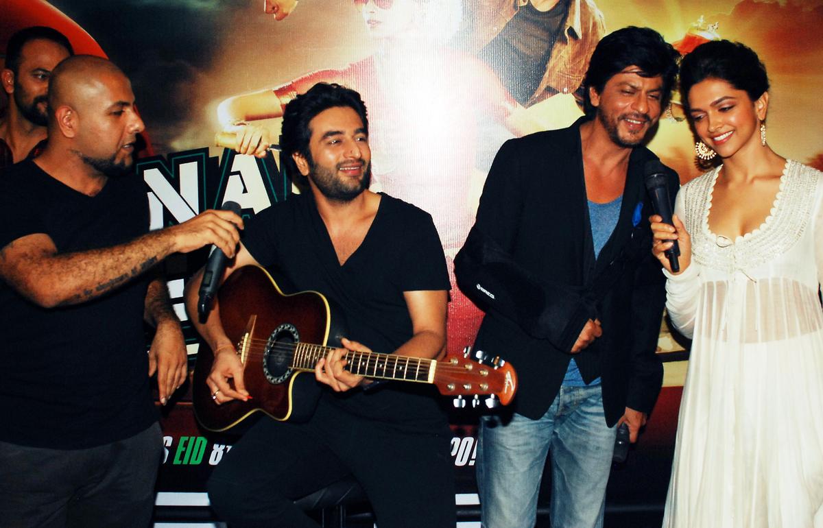 Vishal Dadlani, Shekhar Ravjiani, Shah Rukh Khan and Deepika Padukone during promotions for Hindi film, ‘Chennai Express’ in 2013