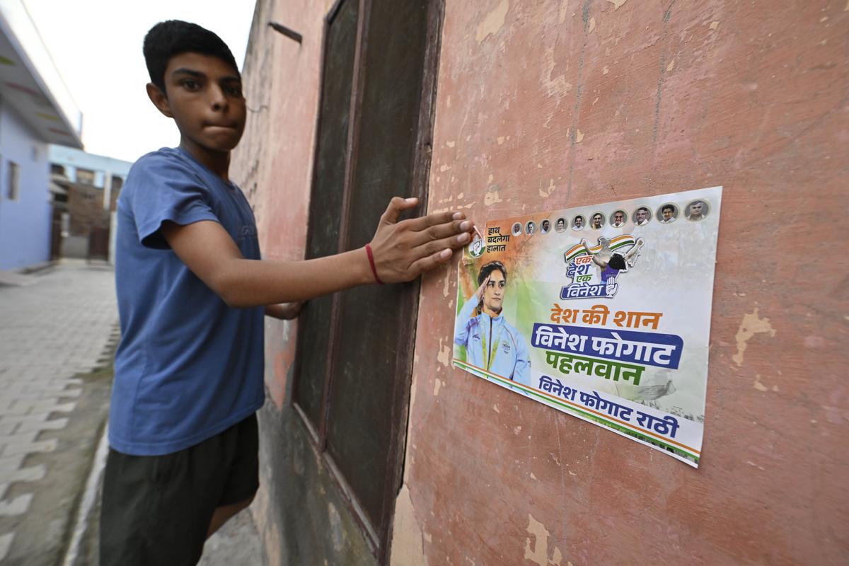 A poster advertising Vinesh Phogat in Bakhta Khera village in Haryana’s Jind.