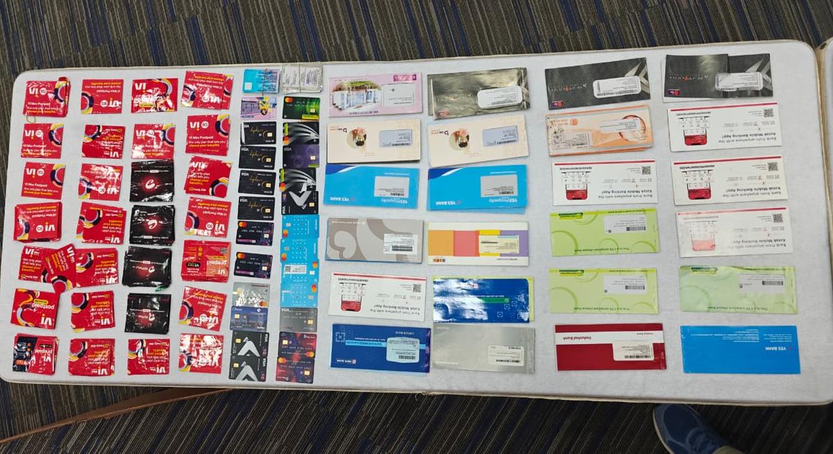 Seized SIM cards, cheque books 