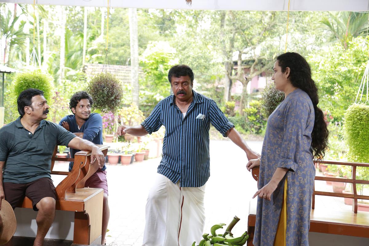 Renji Panicker, Nandu and Muthumani in a scene from the film