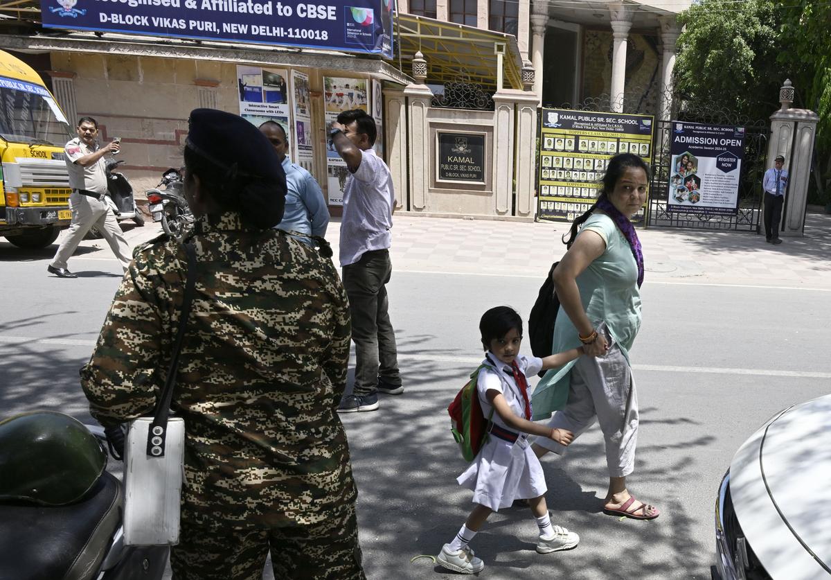 Security personnel outside a school in Vikaspuri in New Delhi on Wednesday.